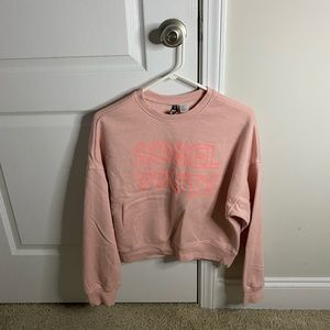 Cropped pink long sleeve sweatshirt